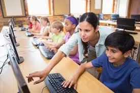 teacher and kid at laptop teach cyber.