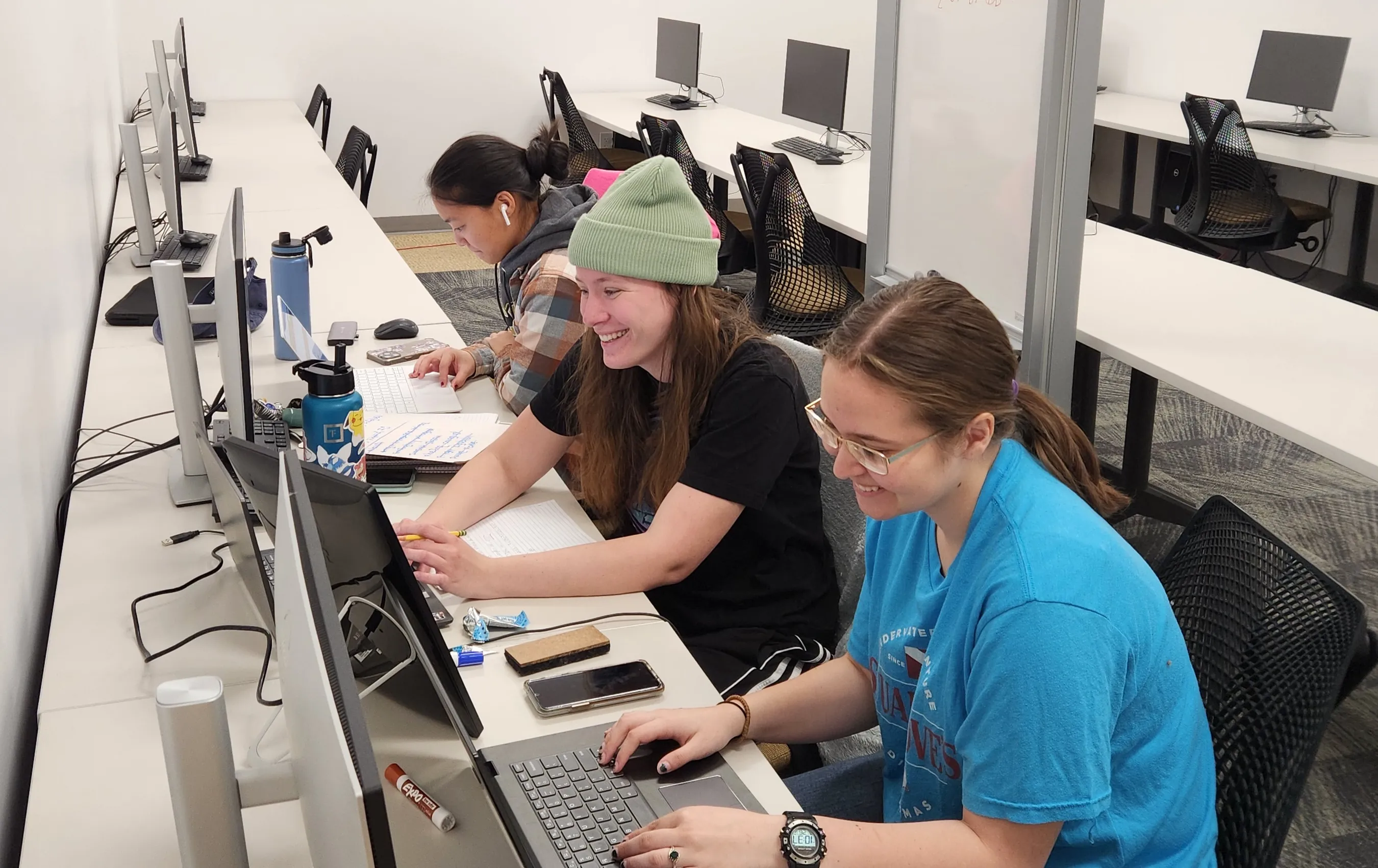 Students sitting at computers in lab.